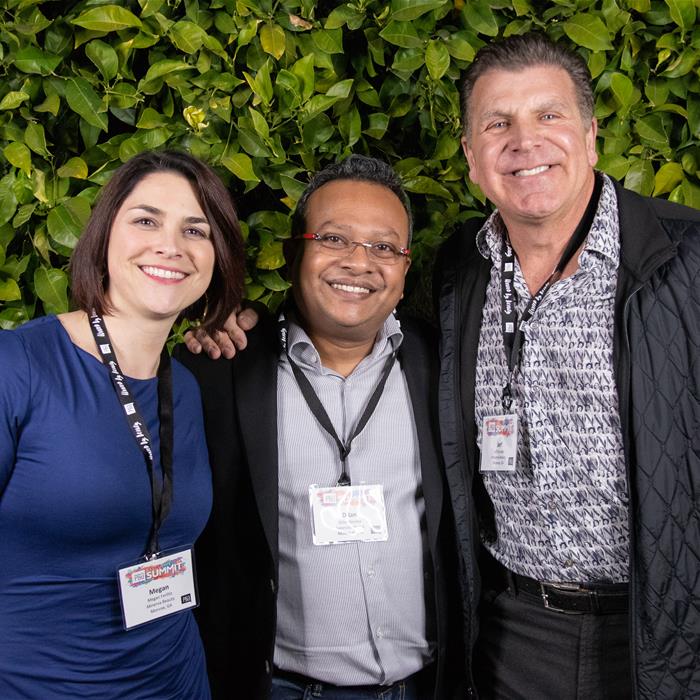 Three Executive Summit 2018 Attendees pose for a picture